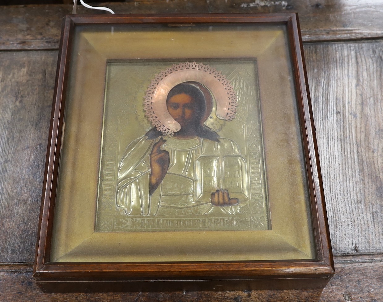 A 19th century Russian icon of Christ Pantocractor, with brass and copper oklad, 26 x 21cm, glazed case